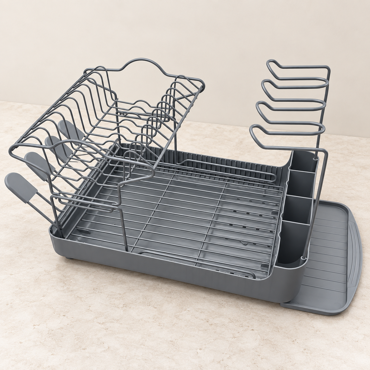 Gray dish drying rack on a light studio countertop