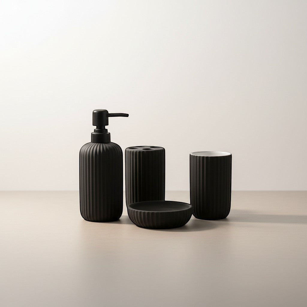 Home Appeal matte black ribbed bathroom accessory set including soap dispenser, toothbrush holder, cup, and soap dish.
